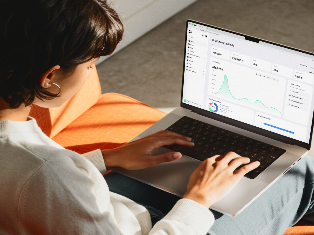Restaurant operator reviewing Rive Back Office on a laptop