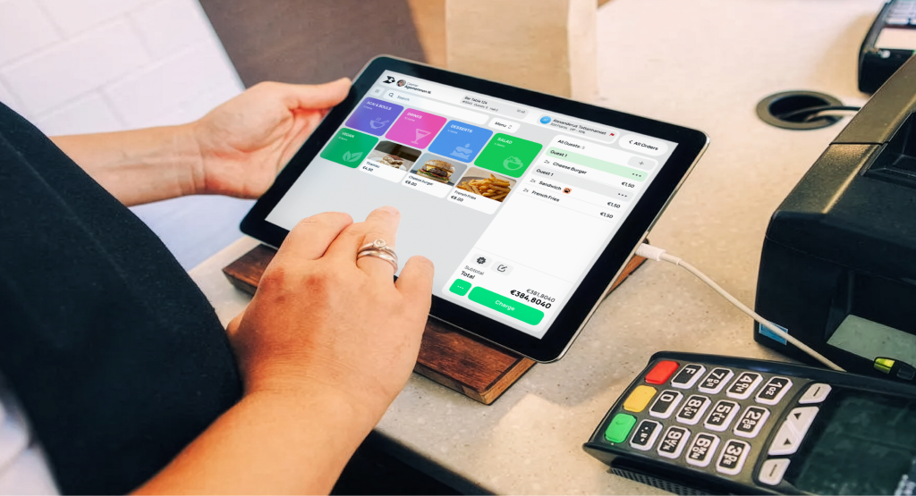 Rive POS on a tablet beside a payment terminal and receipt printer